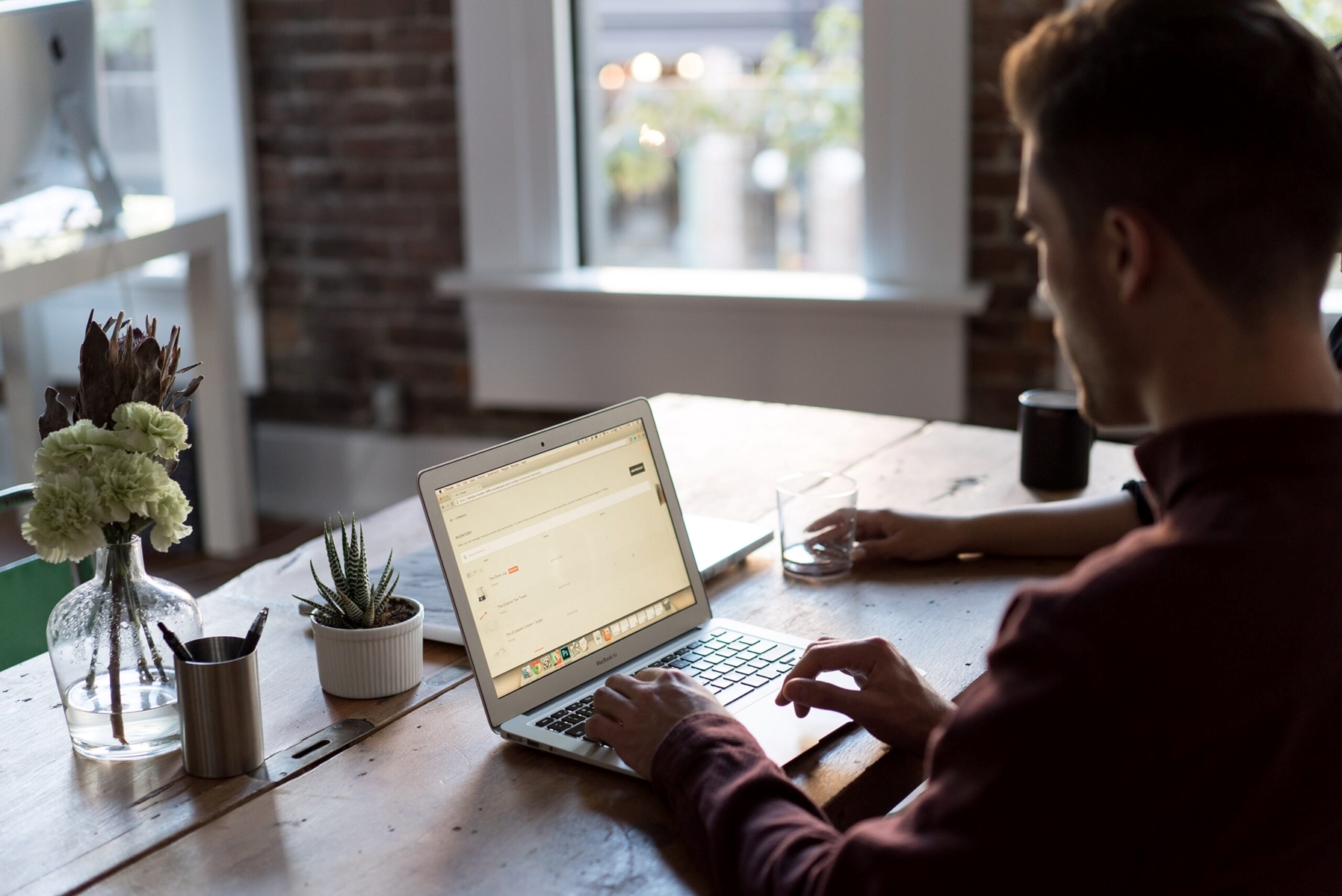 A man looking at an online application